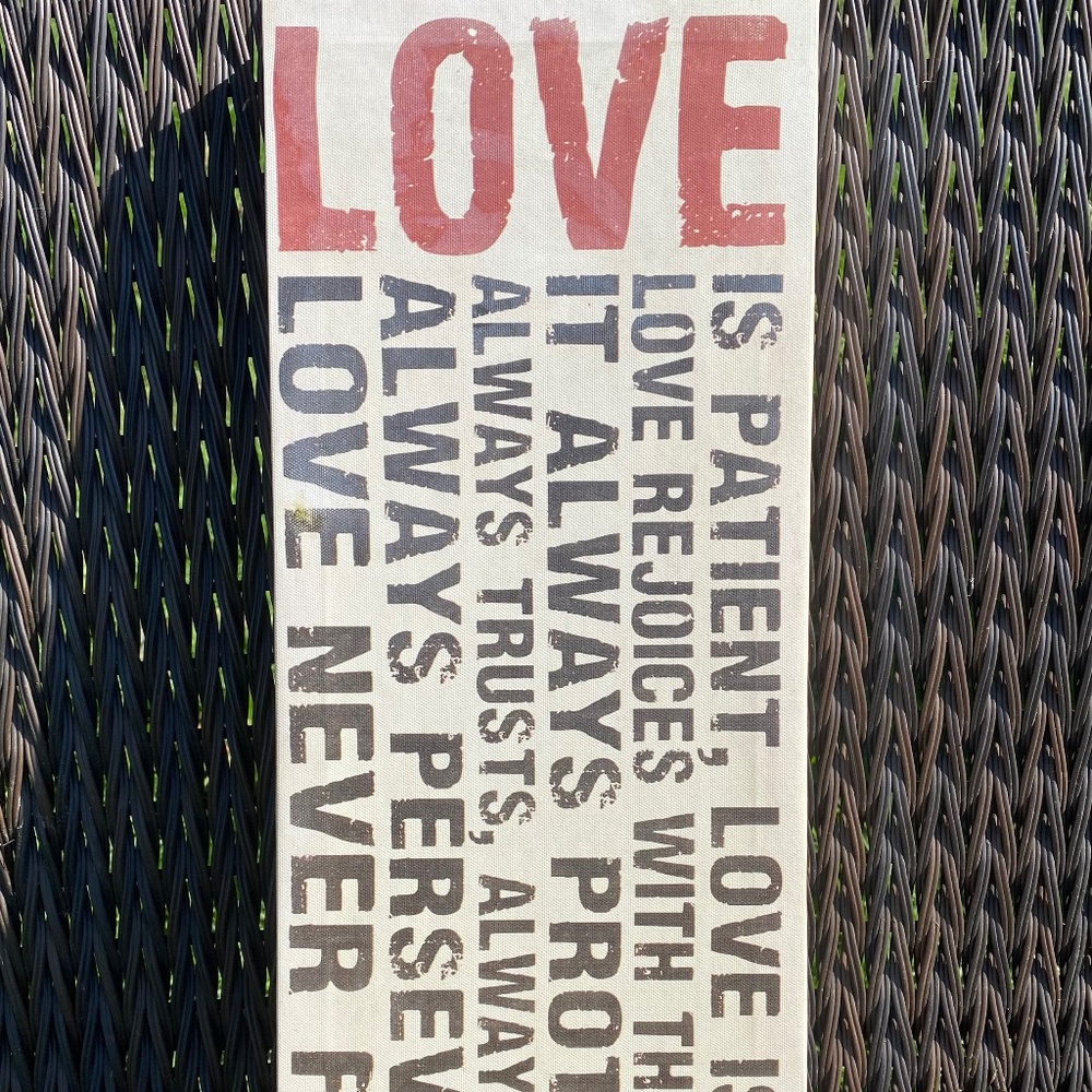 “Love Is…” canvas wall art. Used